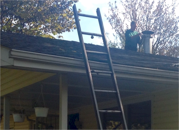 Randy Morse of Chim-Kleen doing the roof work involved in Chimney Cleaning.